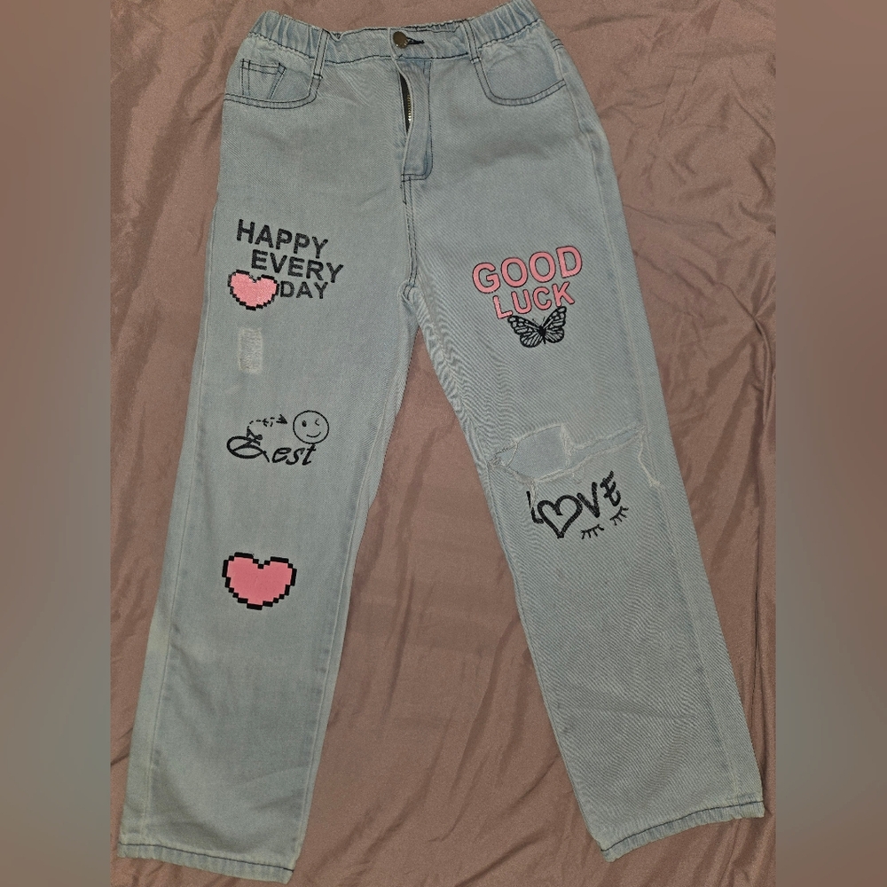 SHEIN Girls Light Blue Baggy Jeans with Rips And Pink and Black Graphics